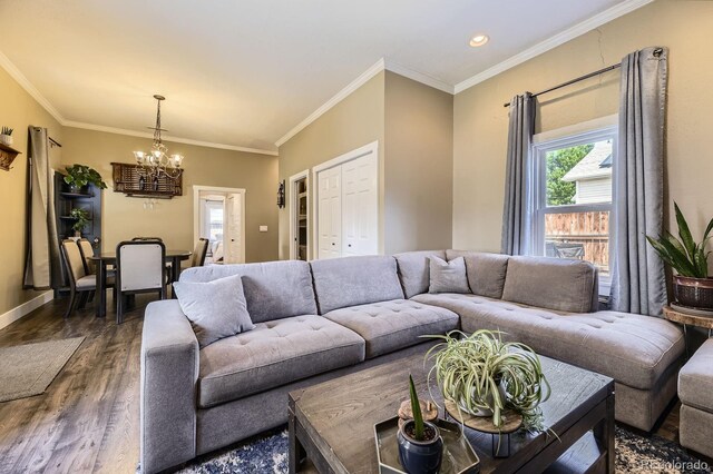 235 W Lehigh Ave, Englewood, CO 80110 - living room featuring a chandelier, dark wood-type flooring, ornamental molding, and recessed lighting
