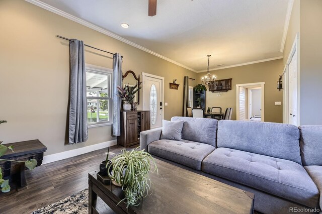 235 W Lehigh Ave, Englewood, CO 80110 - living area with a chandelier, dark wood-type flooring, ornamental molding, and a ceiling fan