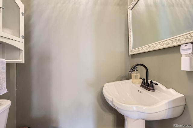 235 W Lehigh Ave, Englewood, CO 80110 - bathroom with toilet and a sink