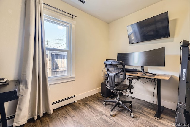 235 W Lehigh Ave, Englewood, CO 80110 - office area with wood finished floors and a baseboard heating unit