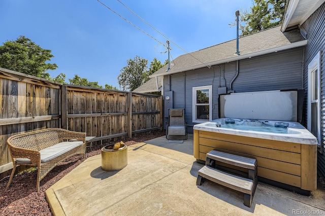 235 W Lehigh Ave, Englewood, CO 80110 - fenced backyard with a hot tub and a patio area