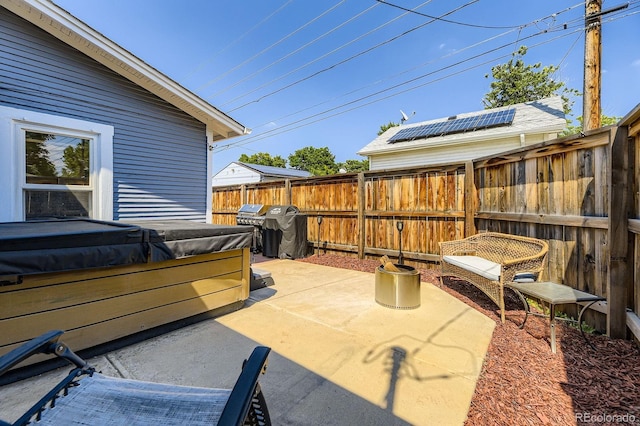 235 W Lehigh Ave, Englewood, CO 80110 - fenced backyard with a hot tub, a patio area, and grilling area