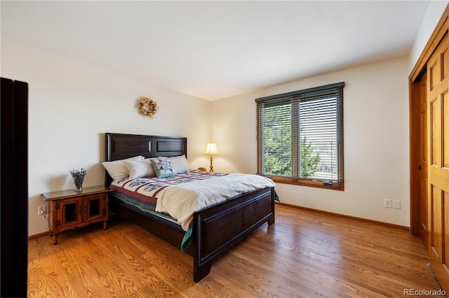 50 Deerwood Dr, Littleton, CO 80127 - bedroom featuring light wood finished floors and baseboards