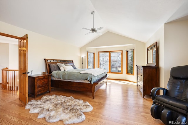 50 Deerwood Dr, Littleton, CO 80127 - bedroom featuring light wood finished floors, vaulted ceiling, and ceiling fan