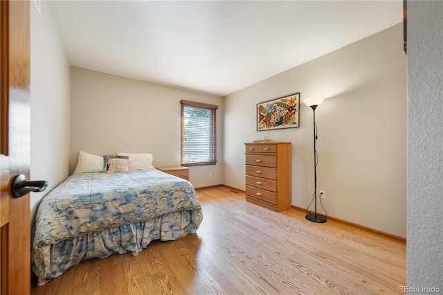 50 Deerwood Dr, Littleton, CO 80127 - bedroom with light wood-style flooring and baseboards
