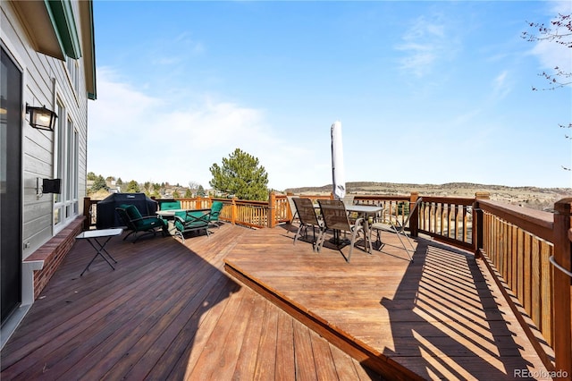 50 Deerwood Dr, Littleton, CO 80127 - wooden deck featuring outdoor dining space