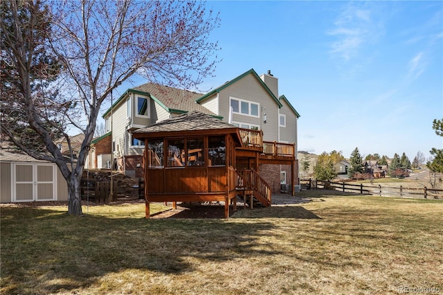 50 Deerwood Dr, Littleton, CO 80127 - rear view of property featuring stairs, a chimney, a deck, and a sunroom