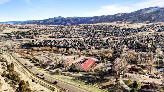 50 Deerwood Dr, Littleton, CO 80127 - aerial overview of property's location featuring a mountain backdrop