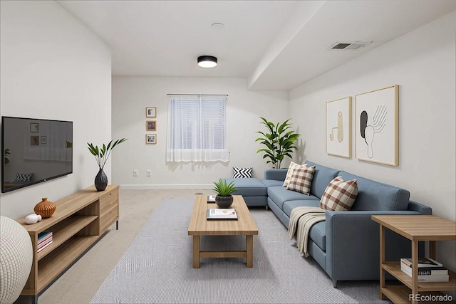carpeted living area featuring baseboards