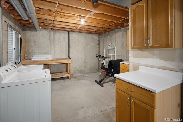 unfinished basement featuring independent washer and dryer