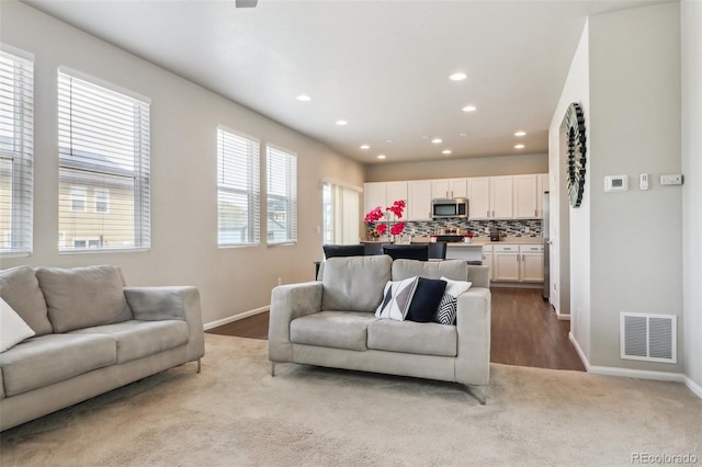 6491 N Danube St, Denver, CO 80249 - living room featuring recessed lighting and baseboards