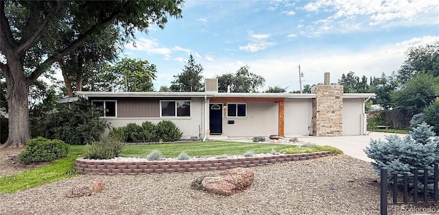 8930 W 55th Ave, Arvada, CO 80002 - single story home featuring driveway, a chimney, and a front yard
