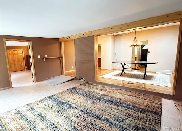 8930 W 55th Ave, Arvada, CO 80002 - empty room with tile patterned floors and a chandelier
