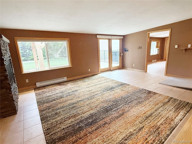 8930 W 55th Ave, Arvada, CO 80002 - unfurnished living room featuring a baseboard radiator, light tile patterned floors, and plenty of natural light