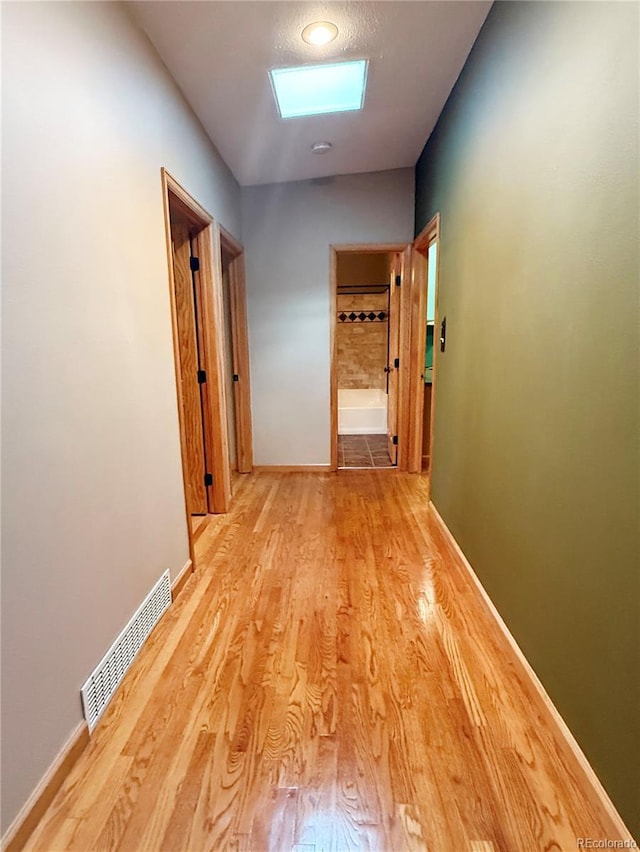 8930 W 55th Ave, Arvada, CO 80002 - hallway featuring wood finished floors and baseboards