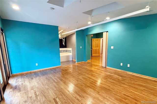 8930 W 55th Ave, Arvada, CO 80002 - unfurnished room featuring wood finished floors, track lighting, and a smoke detector