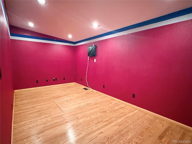 8930 W 55th Ave, Arvada, CO 80002 - spare room featuring wood finished floors, lofted ceiling, and recessed lighting