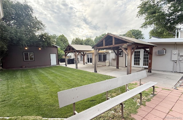 8930 W 55th Ave, Arvada, CO 80002 - view of grassy yard featuring a gazebo, a patio, a wall unit AC, and french doors