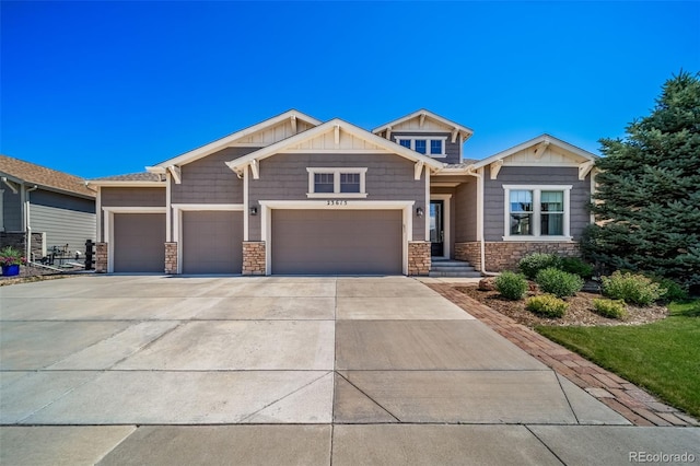 23615 E Del Norte Pl, Aurora, CO 80016 - craftsman-style house featuring stone siding, concrete driveway, and an attached garage