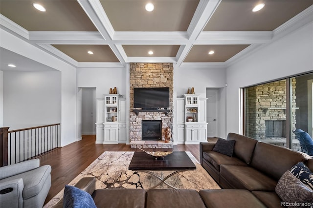 23615 E Del Norte Pl, Aurora, CO 80016 - living area with a stone fireplace, dark wood-style flooring, coffered ceiling, beam ceiling, and crown molding