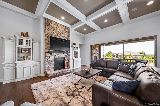 23615 E Del Norte Pl, Aurora, CO 80016 - living room with crown molding, coffered ceiling, a fireplace, beam ceiling, and dark wood-style flooring