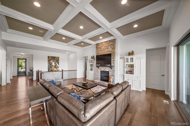 23615 E Del Norte Pl, Aurora, CO 80016 - living room featuring dark wood finished floors, coffered ceiling, beamed ceiling, a fireplace, and ornamental molding