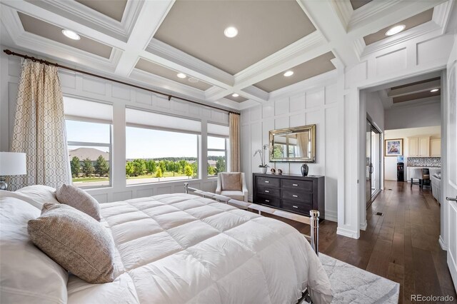 23615 E Del Norte Pl, Aurora, CO 80016 - bedroom featuring coffered ceiling, crown molding, dark wood finished floors, and beam ceiling