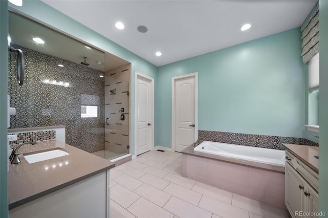 23615 E Del Norte Pl, Aurora, CO 80016 - bathroom with vanity, a stall shower, tile patterned floors, a bath, and recessed lighting