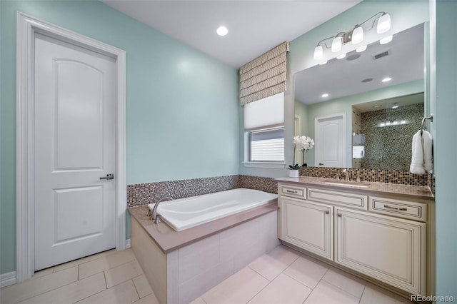 23615 E Del Norte Pl, Aurora, CO 80016 - bathroom featuring vanity, a bath, a stall shower, and tile patterned floors