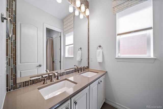 23615 E Del Norte Pl, Aurora, CO 80016 - full bath with double vanity and baseboards