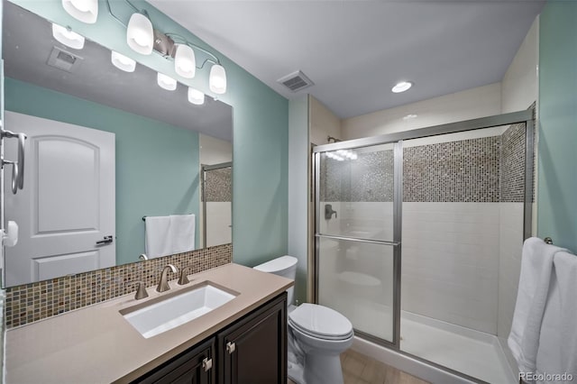 23615 E Del Norte Pl, Aurora, CO 80016 - bathroom featuring a shower stall, vanity, and backsplash