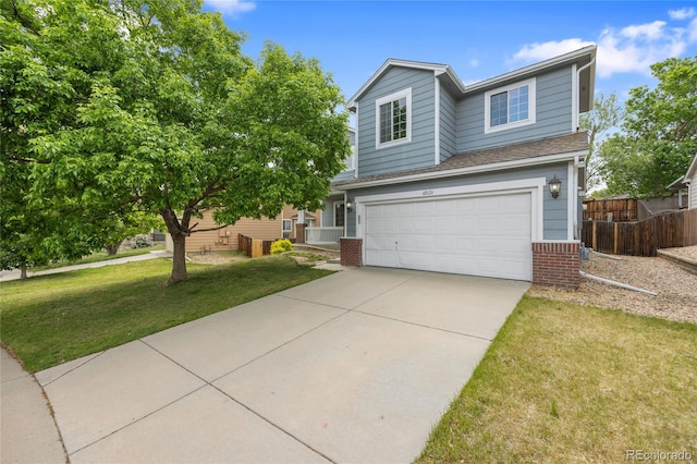 18121 E Adriatic, Aurora, CO 80013 - view of front of home featuring concrete driveway, a garage, and brick siding