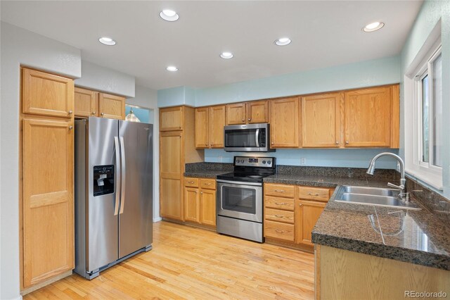18121 E Adriatic, Aurora, CO 80013 - kitchen featuring appliances with stainless steel finishes, a sink, light wood-style flooring, and recessed lighting