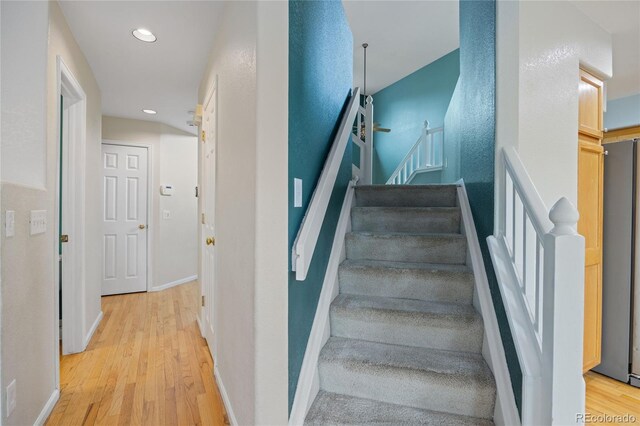 18121 E Adriatic, Aurora, CO 80013 - staircase featuring wood finished floors, recessed lighting, and baseboards