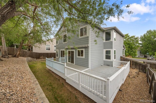 18121 E Adriatic, Aurora, CO 80013 - back of property featuring a wooden deck