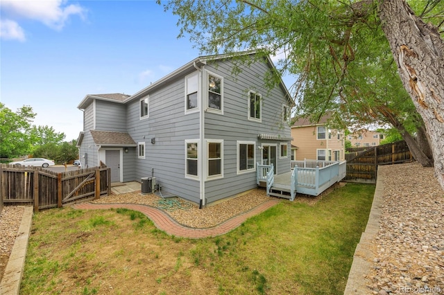 18121 E Adriatic, Aurora, CO 80013 - rear view of house with a wooden deck and central air condition unit