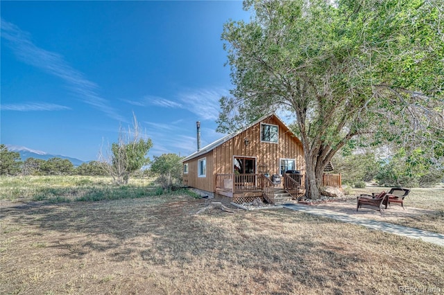 rear view of property with a deck