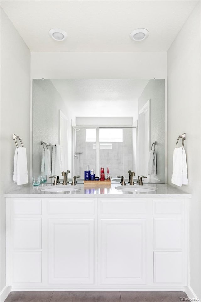 500 176th Ave, Broomfield, CO 80023 - bathroom with a sink, a shower with door, and double vanity