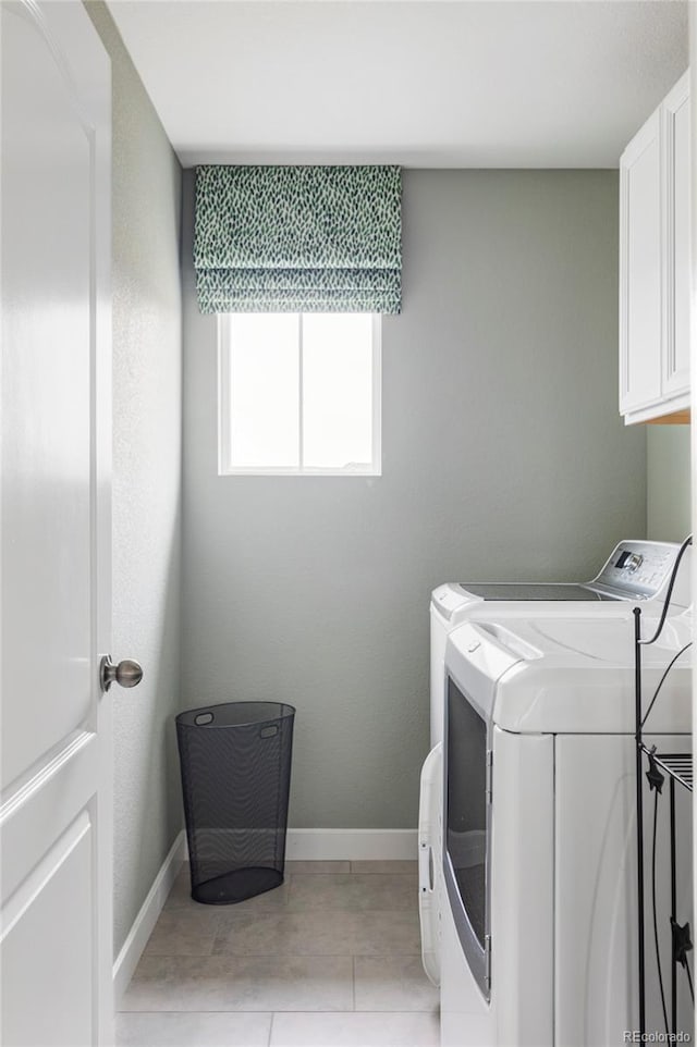 500 176th Ave, Broomfield, CO 80023 - laundry room featuring cabinet space, baseboards, and washing machine and dryer