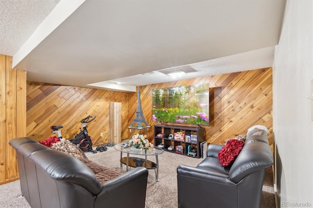 carpeted living area featuring wooden walls