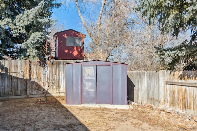 view of shed featuring a fenced backyard