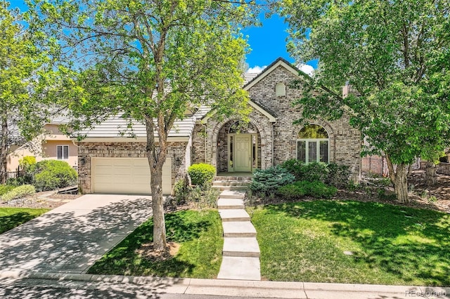 85 Silver Fox Dr, Greenwood Village, CO 80121 - view of front facade with driveway, a front lawn, and an attached garage