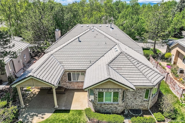 85 Silver Fox Dr, Greenwood Village, CO 80121 - back of house with a chimney and a tile roof