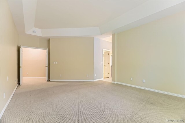 85 Silver Fox Dr, Greenwood Village, CO 80121 - unfurnished room with light carpet, baseboards, and a tray ceiling