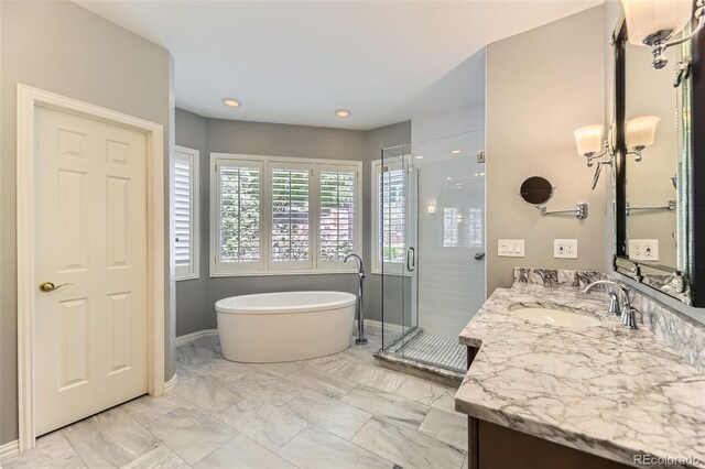 85 Silver Fox Dr, Greenwood Village, CO 80121 - full bathroom with a shower stall, a soaking tub, vanity, marble look tile flooring, and baseboards
