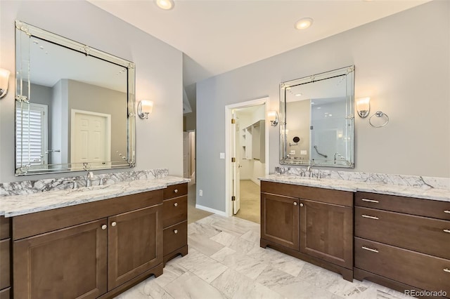 85 Silver Fox Dr, Greenwood Village, CO 80121 - full bathroom featuring two vanities, recessed lighting, and baseboards