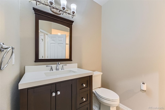 85 Silver Fox Dr, Greenwood Village, CO 80121 - half bathroom with toilet, vanity, and baseboards