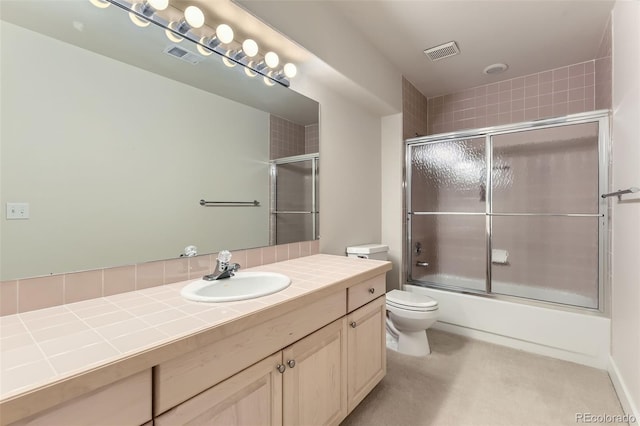 85 Silver Fox Dr, Greenwood Village, CO 80121 - full bathroom featuring toilet, vanity, and shower / bath combination with glass door