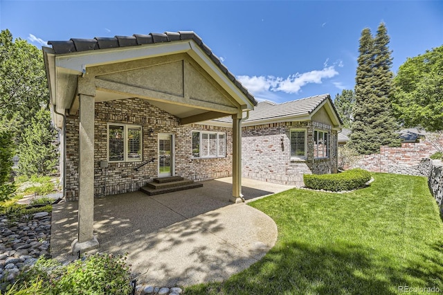 85 Silver Fox Dr, Greenwood Village, CO 80121 - back of property with a patio, a lawn, and a tile roof