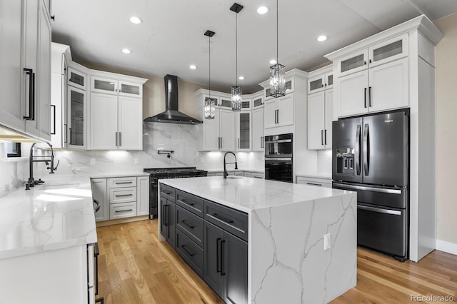 16250 Kenosha St, Brighton, CO 80603 - kitchen with refrigerator with ice dispenser, dobule oven black, a sink, white cabinets, and wall chimney range hood